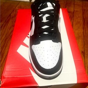 Nike Black and White Leather Sneakers with Swoosh Design